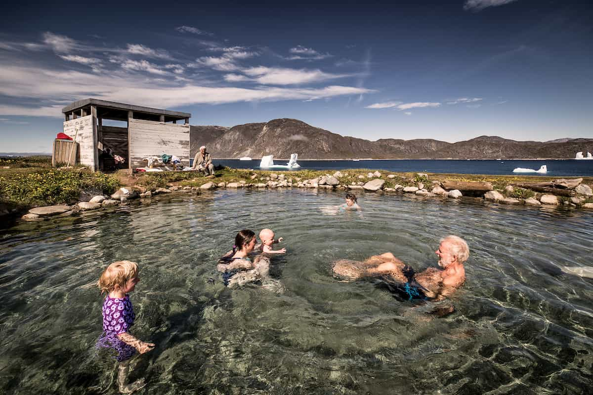 A family enjoying the Uunartoq Hot Springs in south greenland