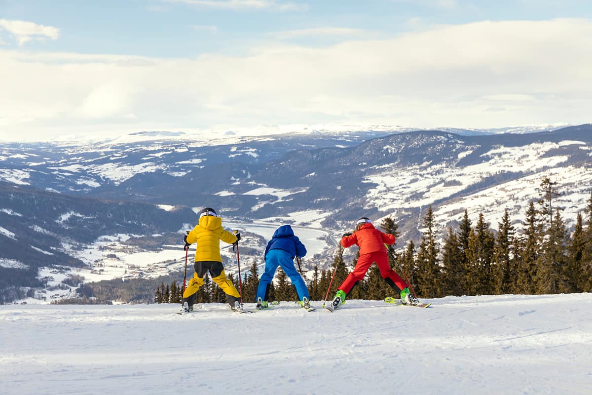 Alpine skiing in Norway with snow-covered slopes rugged mountain scenery and clear winter skies capturing the thrill of Nordic outdoor adventure
