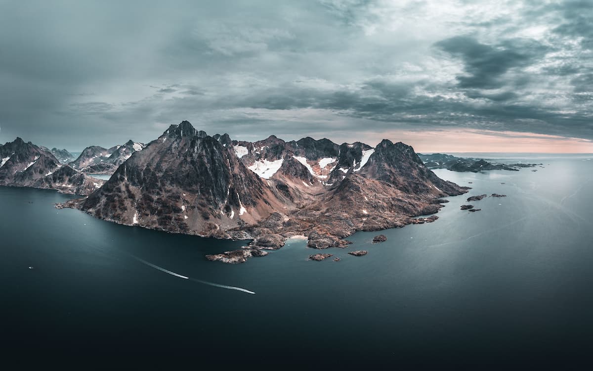 Remote landscapes of East Greenland with towering mountains deep fjords and untouched Arctic wilderness