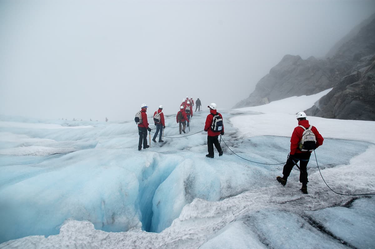 Glacier landscape in Folgefonna National Park, featuring sweeping ice formations and rugged mountain terrain