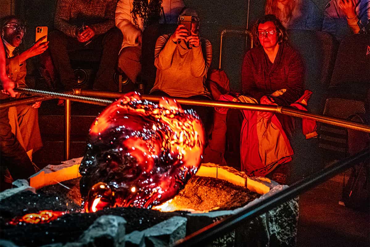 Molten lava glowing red-hot during a live lava show in Iceland, showcasing volcanic power in a controlled setting