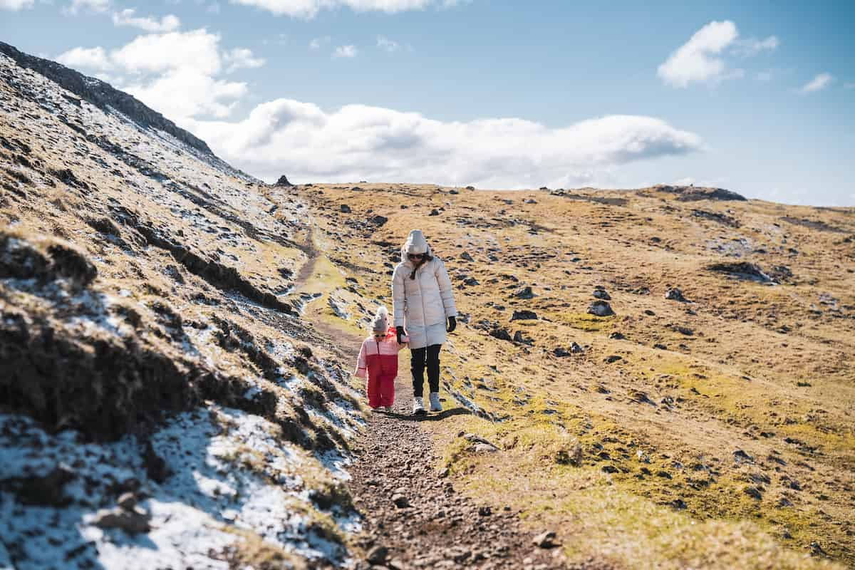 Mother and a daughter walking in Faroe Islands