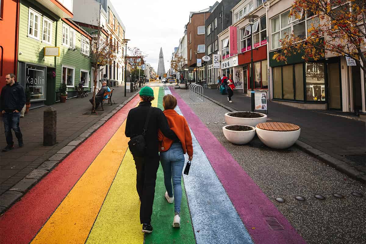 Skólavörðustígur street in Reykjavík, Iceland, lined with colorful buildings and leading up to Hallgrímskirkja church