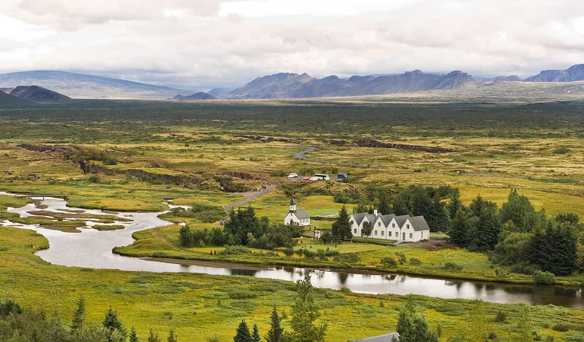 Thingvellir National Park in Iceland with dramatic rift valley landscapes, rocky cliffs, and clear waters between tectonic plates