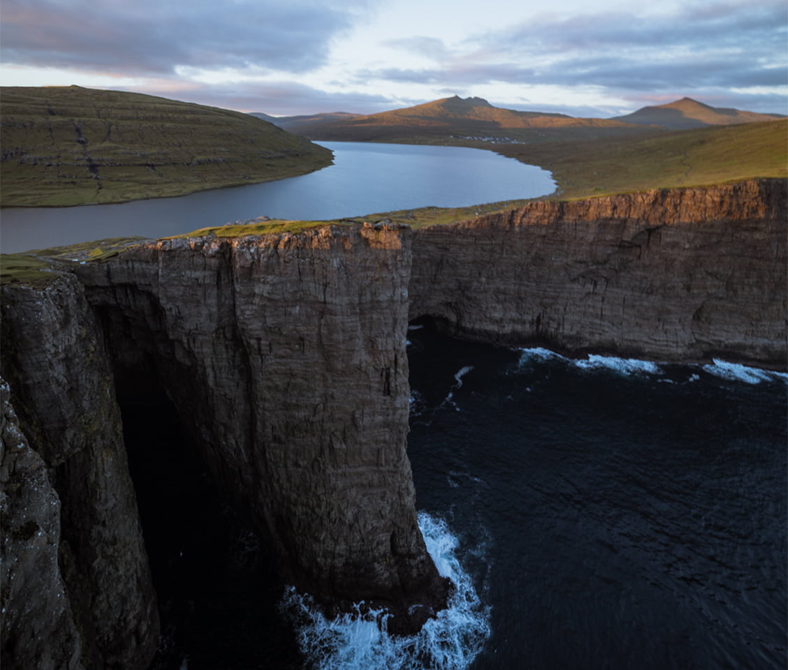 Trælanípa cliff in the Faroe Islands with Lake Sørvágsvatn appearing to hover above the ocean