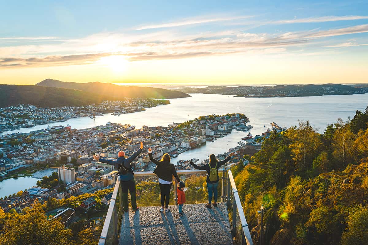 Colorful waterfront buildings and surrounding hills in Bergen, Norway, capturing the charm and coastal beauty of this historic city