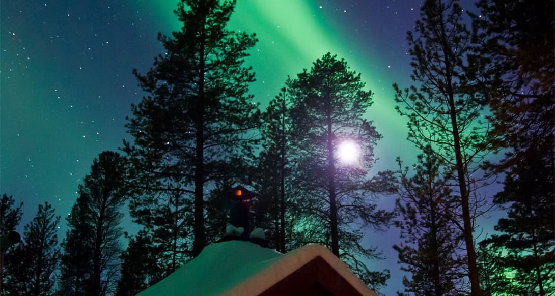 Cabin in northern lights in Finland