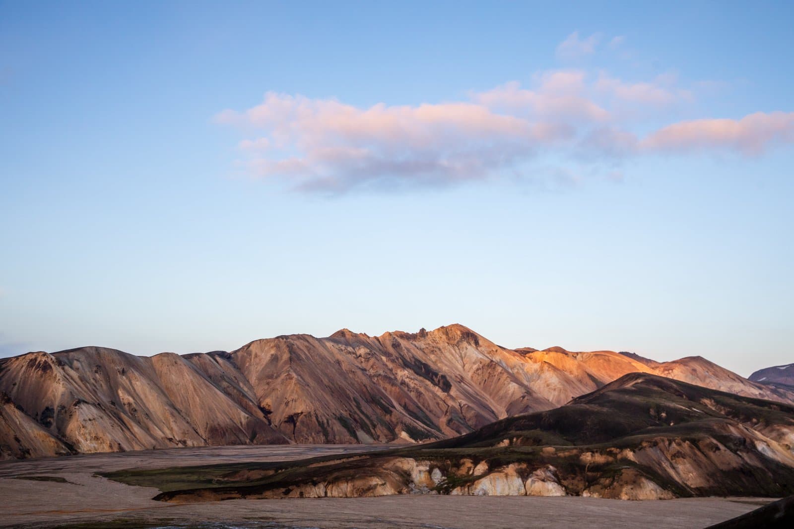 Sweeping Icelandic landscape with mountains rivers and open skies capturing the raw natural beauty and vastness of Icelandic terrain
