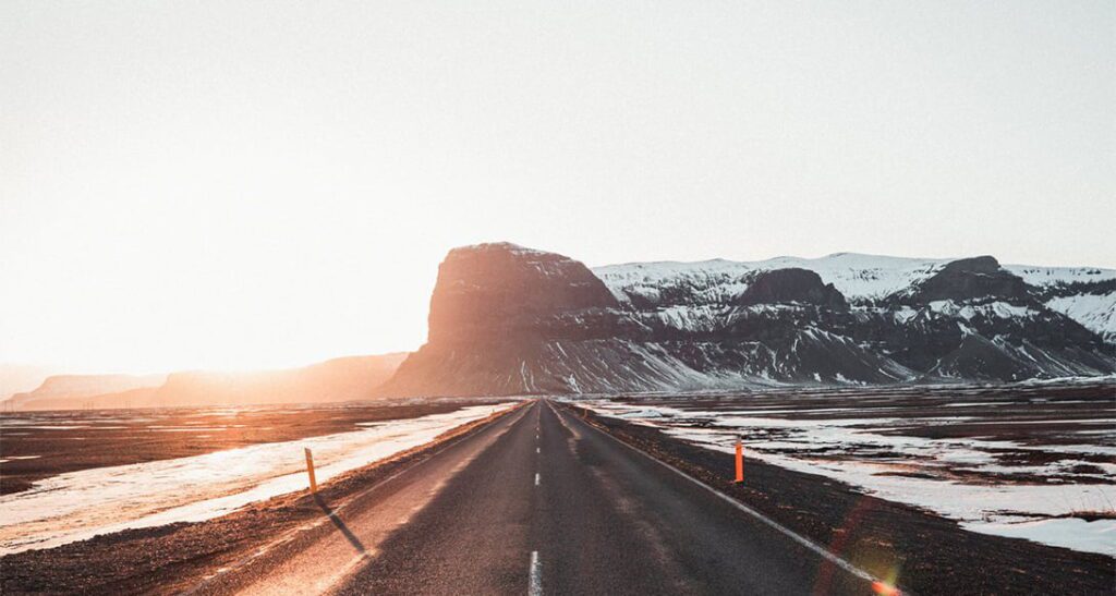 Lómagnúpur mountain rising steeply from the plains of South Iceland with moss-covered cliffs and a flat peak steeped in Icelandic legend