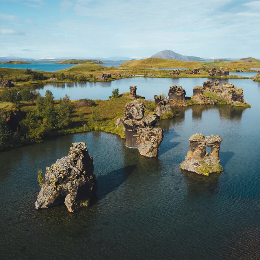 Volcanic lake at Mývatn in North Iceland surrounded by lava fields pseudocraters and rich birdlife in a unique geothermal landscape